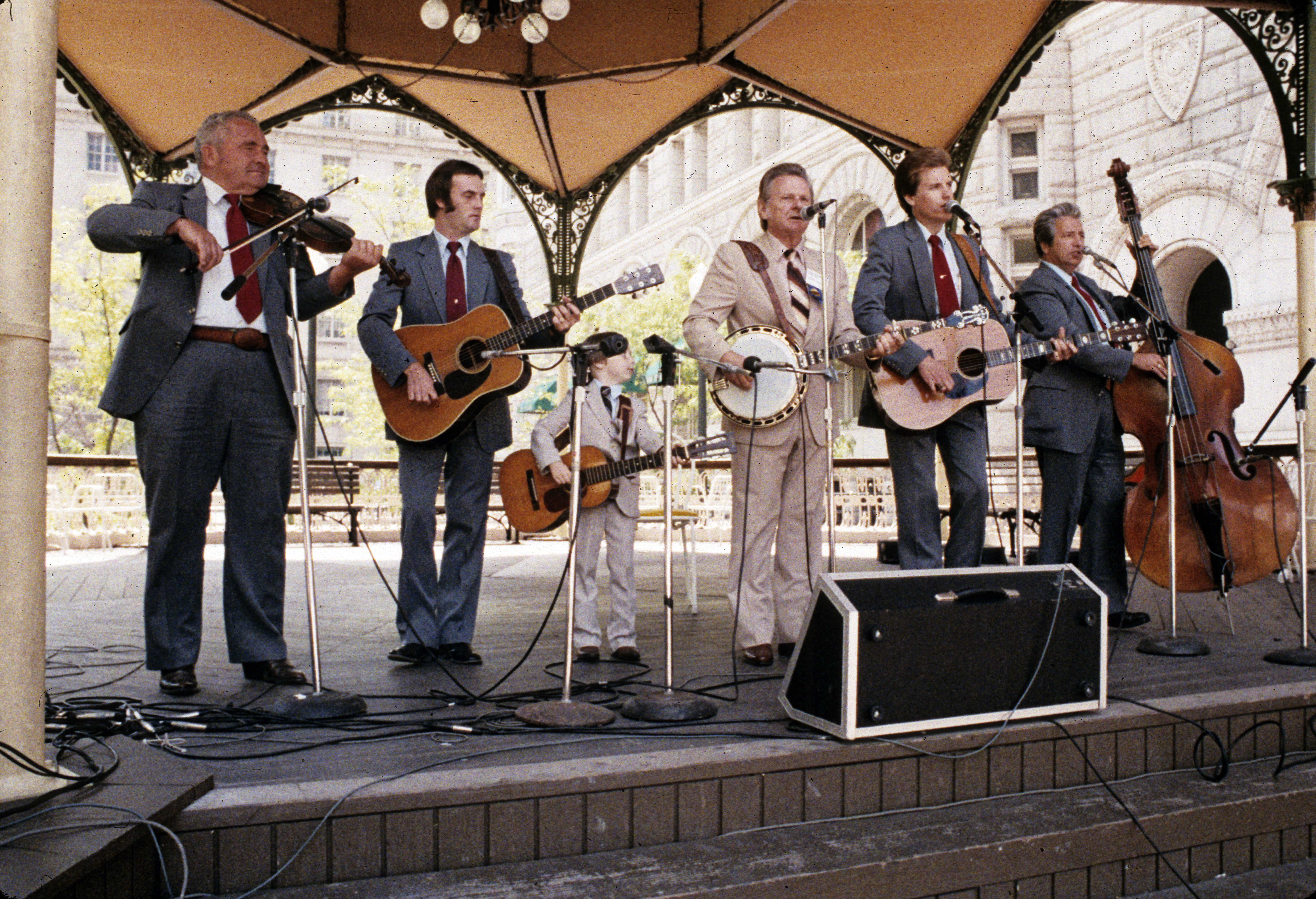 bluegrass band under tent performing in front of the Old Post Office building