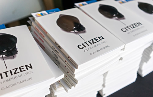 Stacks of the book Citizen: An American Lyric on a table at the Denver Talks program