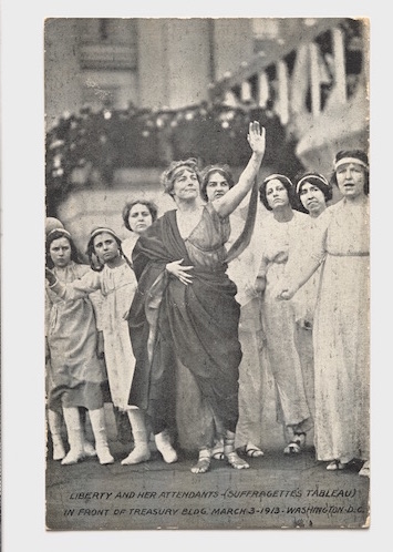 a group of women in classical dress protesting 
