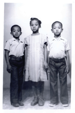 Old black and white photograph of three young children