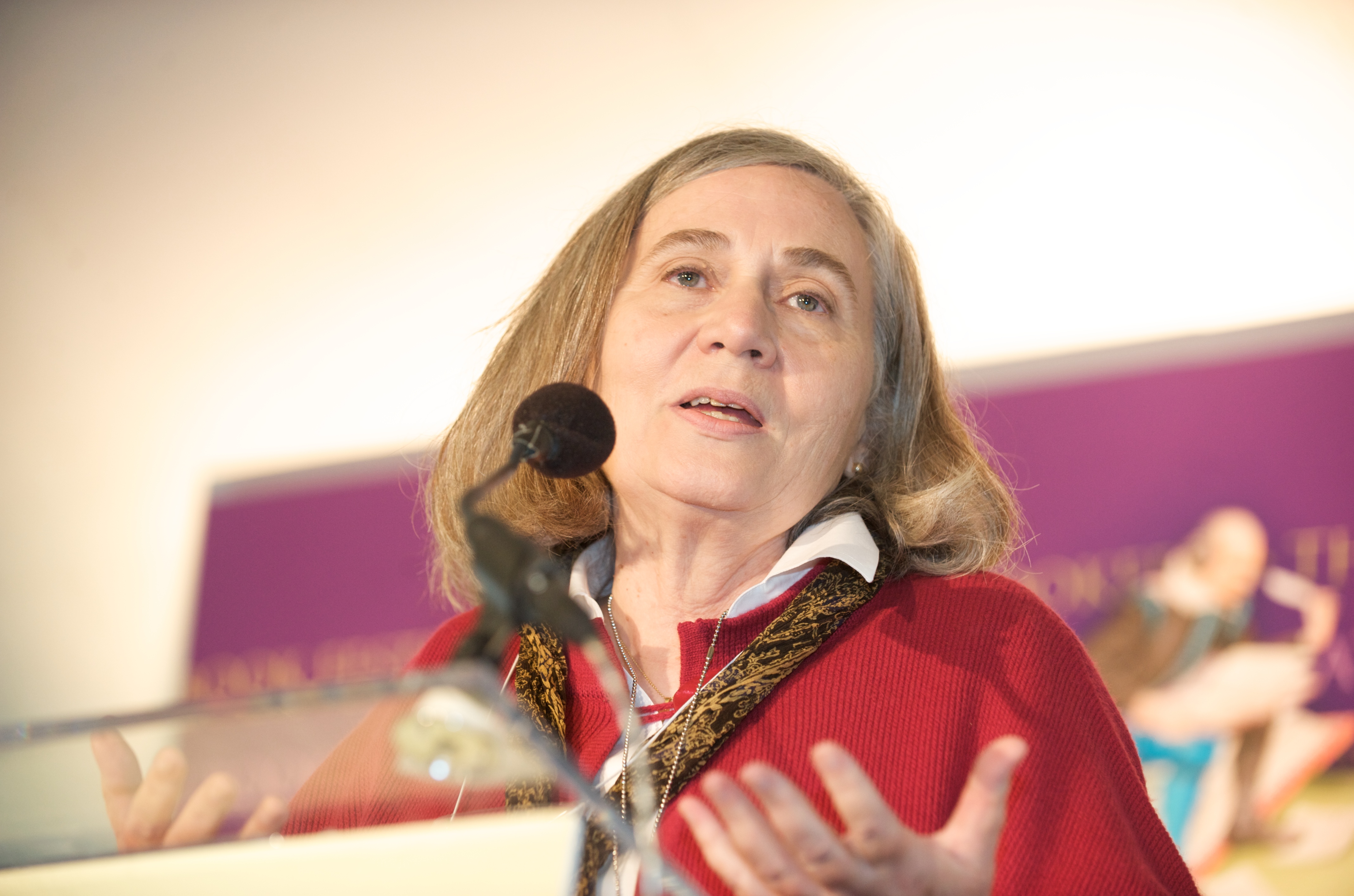 Marilynne Robinson speaking into a mic on stage.