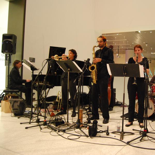 A band playing at a museum. 