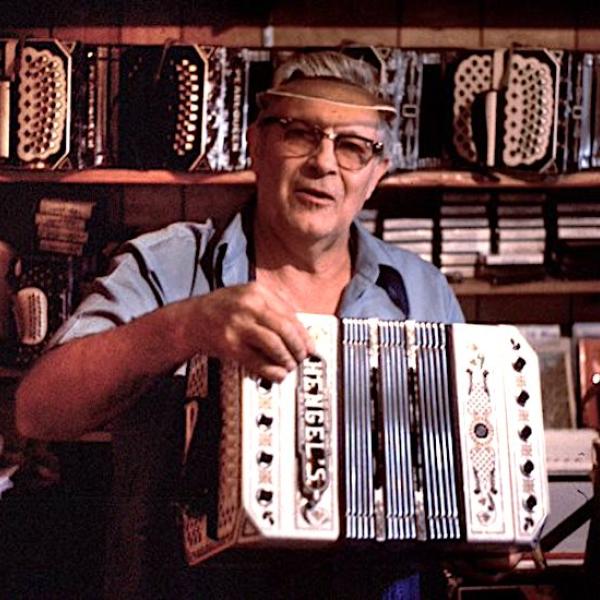 Man holding an accordion.