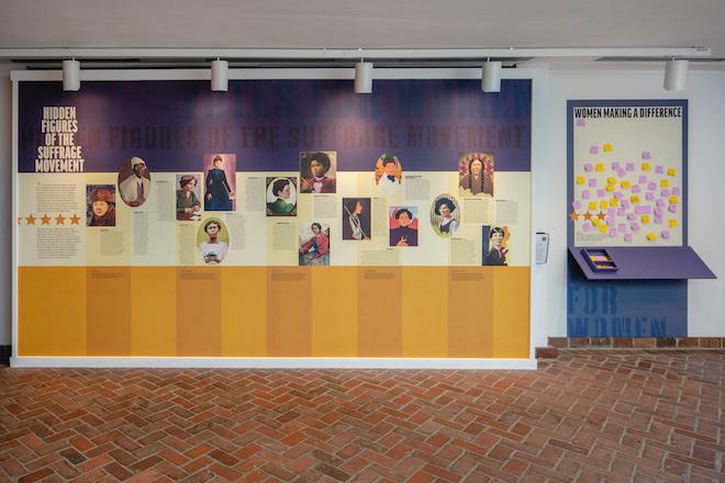 a mural of the faces of various women of color who were part of the women's suffrage movement