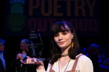 Isabella Callery holds her Poetry Out Loud National Champion glass trophy