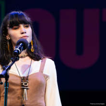 Isabella Callery recites on stage at the Poetry Out Loud National Finals