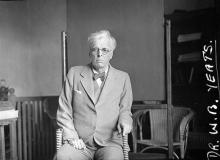 WB Yeats sitting in an office