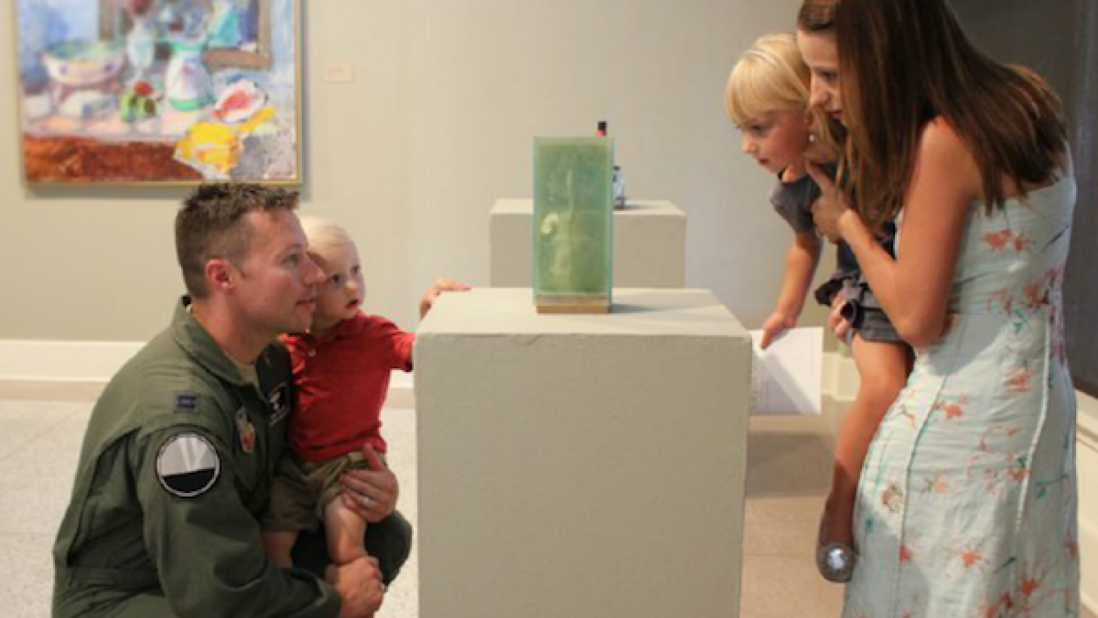 Military family visits art gallery