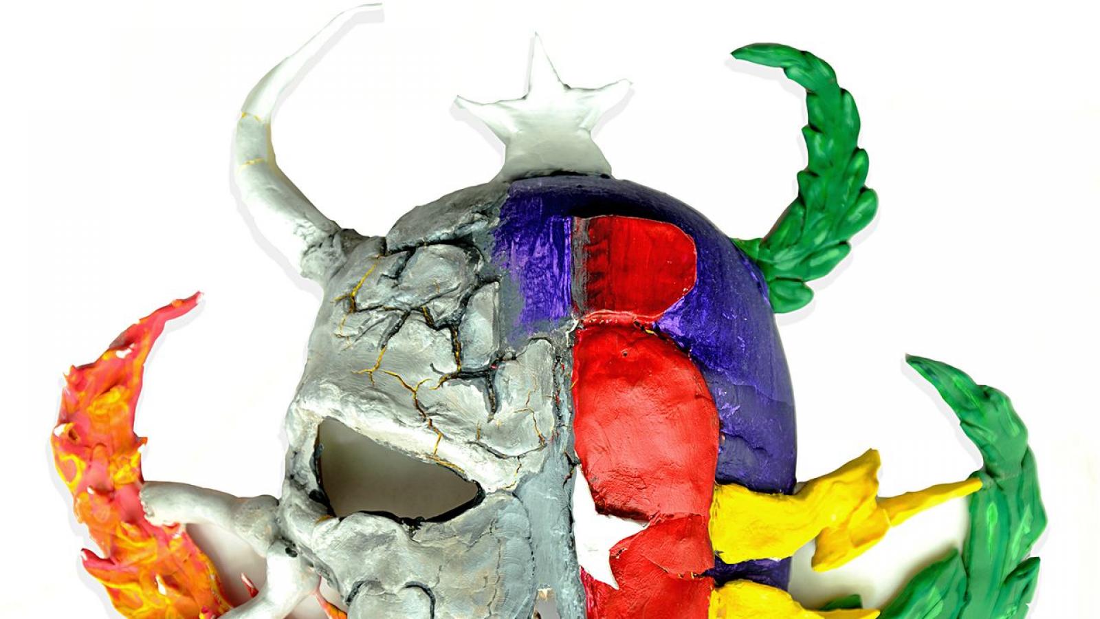 mask with half a skull and flame and half with laurels and lightning