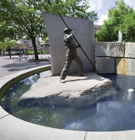 The Worker, a part of the Lowell Public Art Collection, which commissions contemporary artists to honor the city&#039;s history as a mill town. Photo courtesy of Lowell National Historical Park/Higgins &amp; Ross