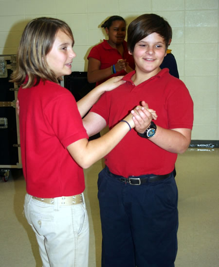  Two students from Bay/Waveland Middle School during a ballroom dance class as part of the Mississippi Arts Commission's program, Moving Toward the Art of Good Health. 