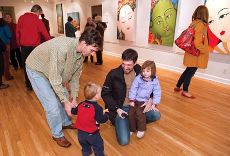 Adults and children at a gallery 