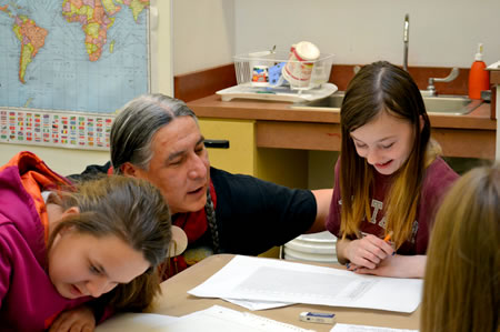 Yellow Bird works with students during the Cultural Crossroads Program. Photo courtesy of Sondra Hines