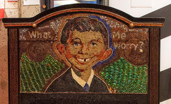 A beaded headboard depicting Alfred E Neuman