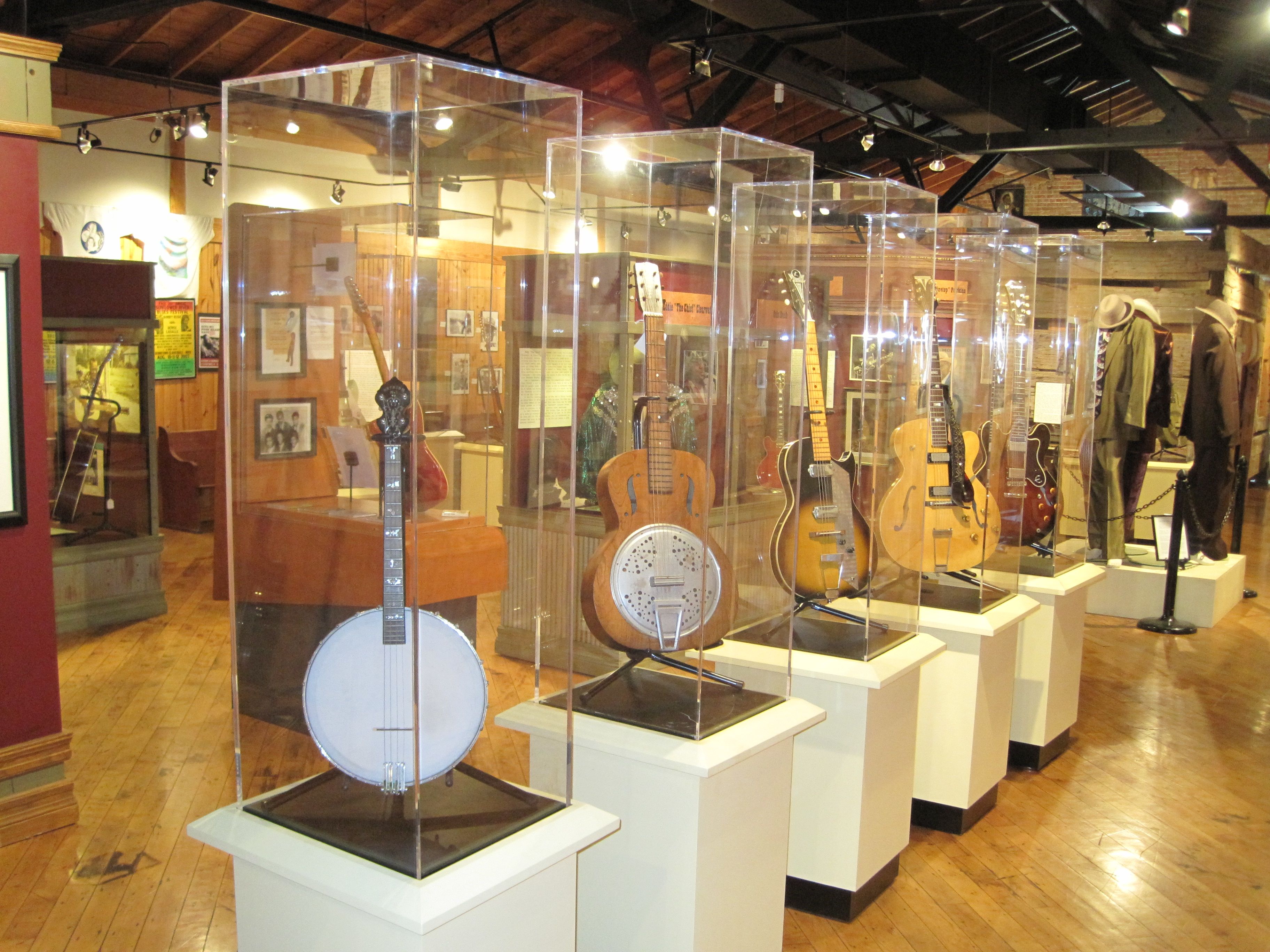 Instruments in glass cases inside a museum gallery. 