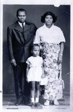 Portrait of a young girl with two adults