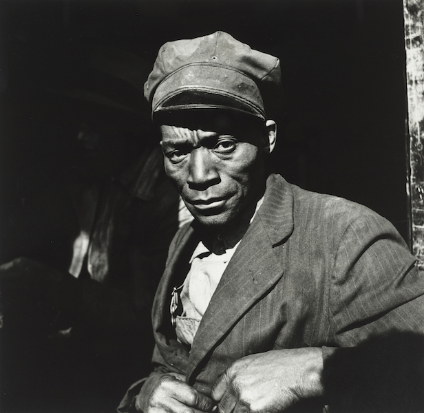portrait of a black man who is a coal sketcher