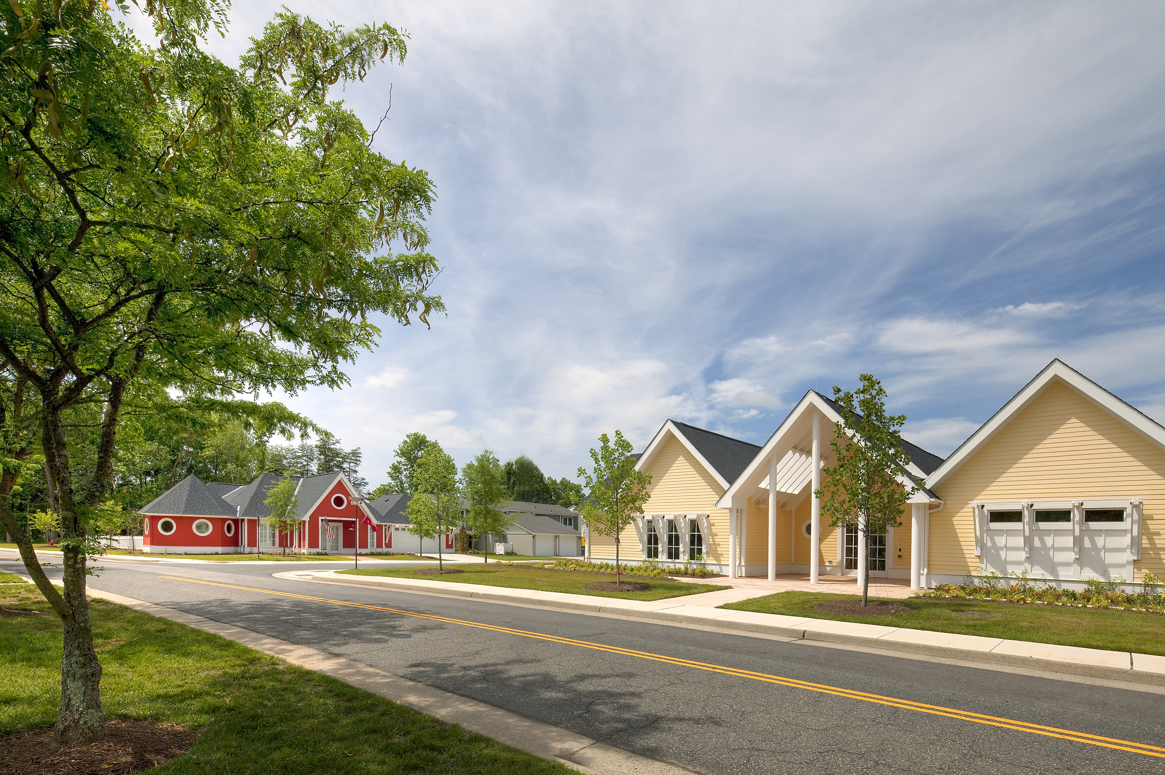 Two houses on a street. 