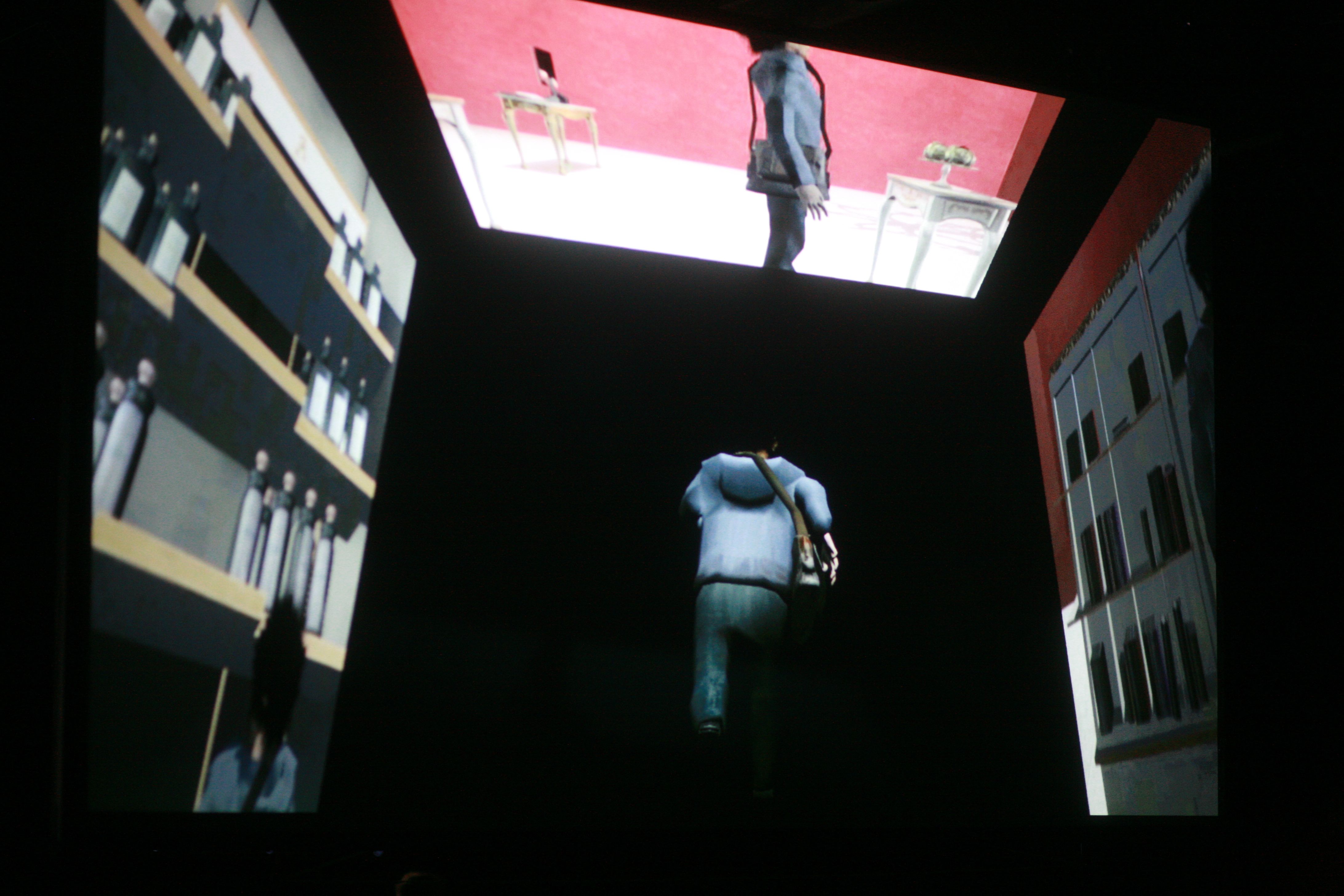 A computer-generated figure dances in front of three screened backgrounds.