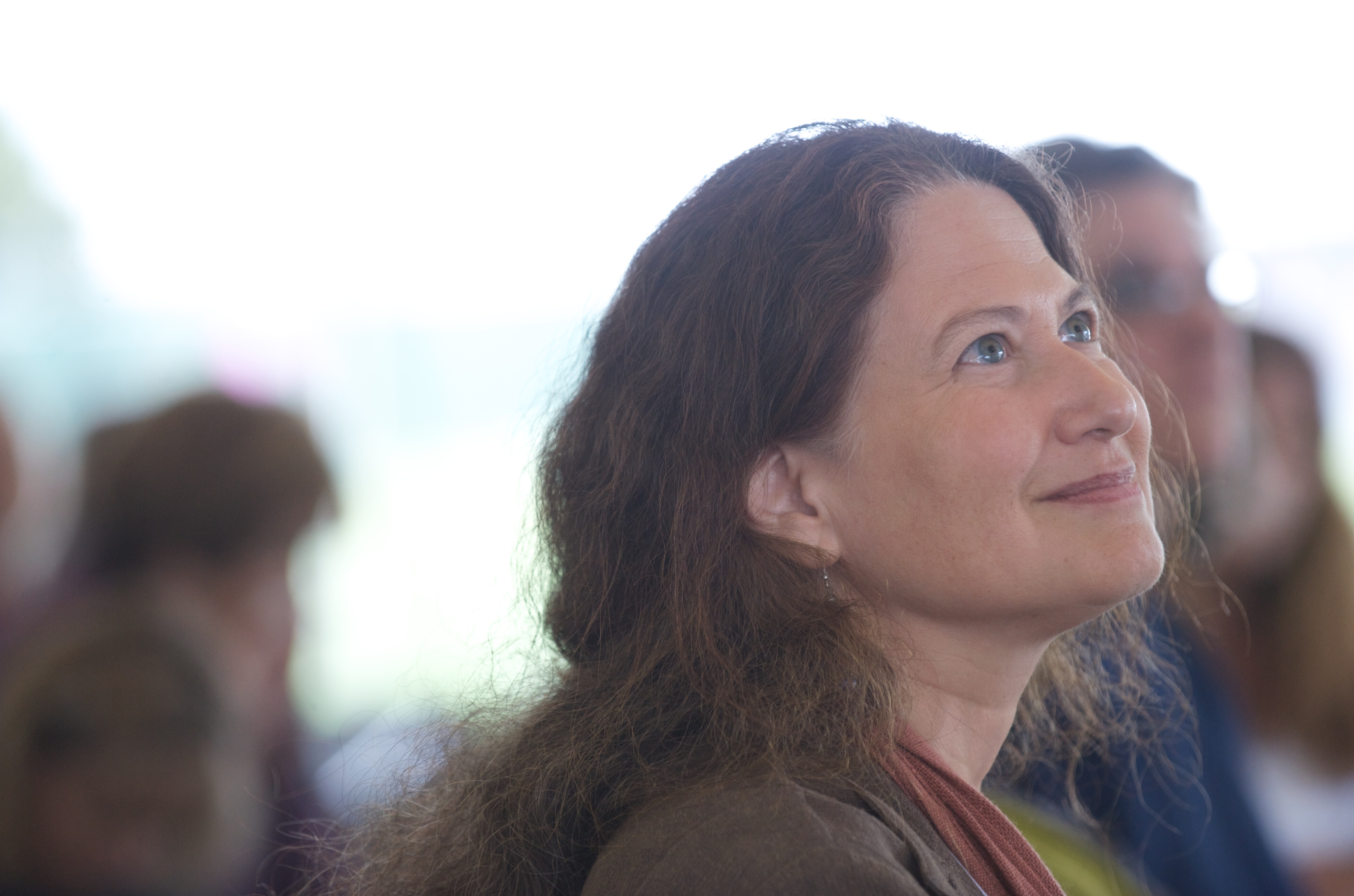 Jane Hirshfield looking up at a fellow reader.