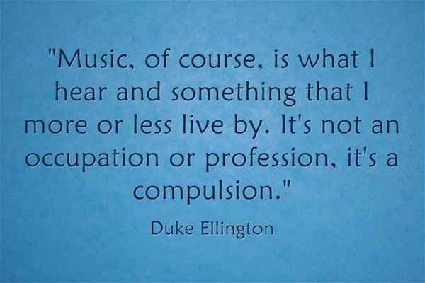 Music is of course is what I hear and something that I more of less live by It's not an occupation or profession, it's a compulsion Duke Ellington black text on blue ground