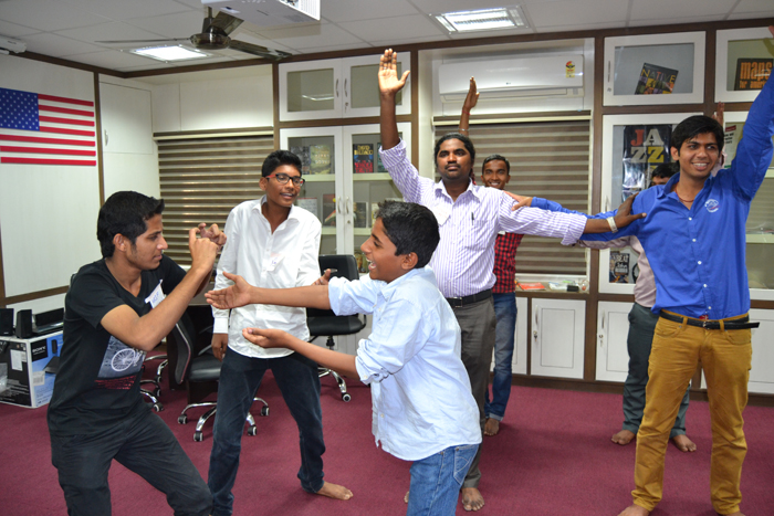 Indian boys and young males in Chennai strike poses for a play. 