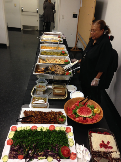 Woman serving food from sterno trays