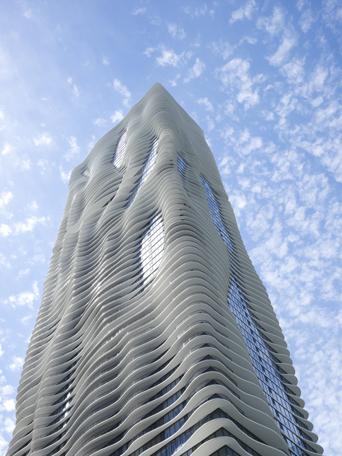 Apartment building with terraces shaped like waves. 