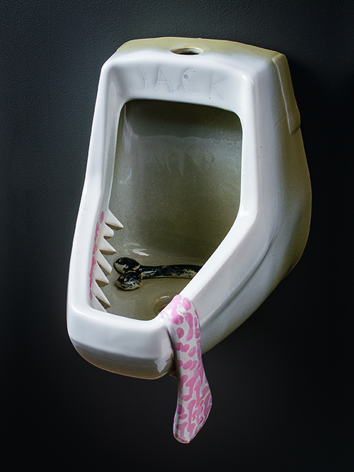A urinal sculpture with a tongue.