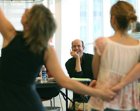 Man watching theater artist perform. 