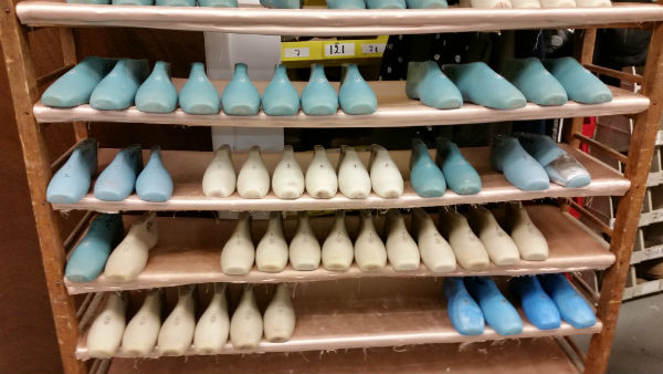 Rows of pastel colored foot-like forms which are used to make shoes
