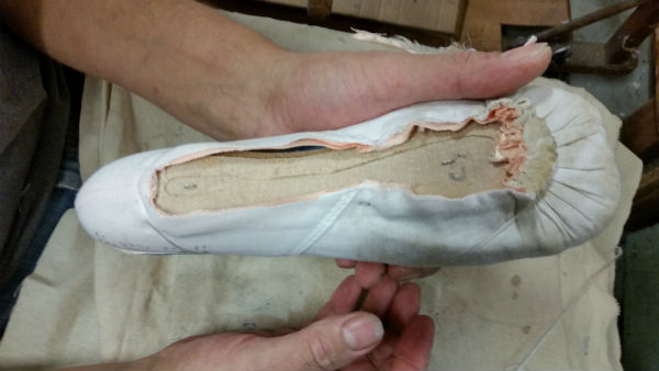 White pleated fabric shaped like a foot