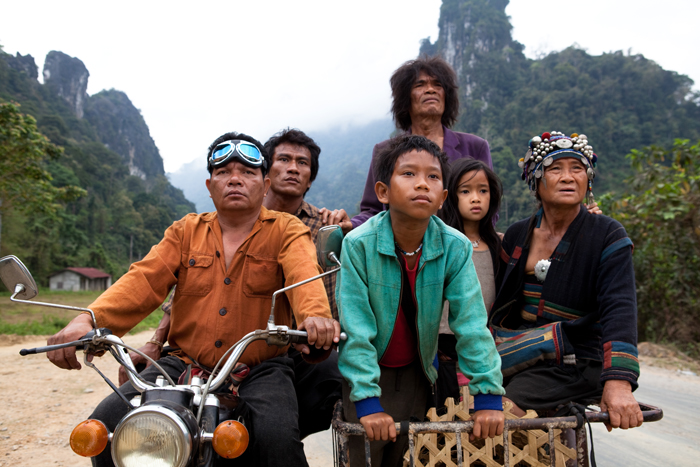 Cast of The Rocket standing in front of mountains in Laos.