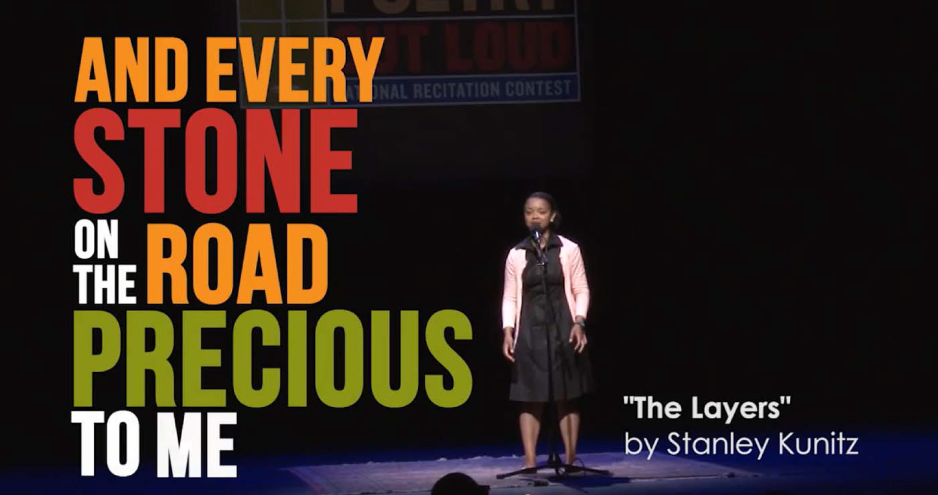 Young woman recites poetry. A young woman recites a poem, the words are displayed on the screen.