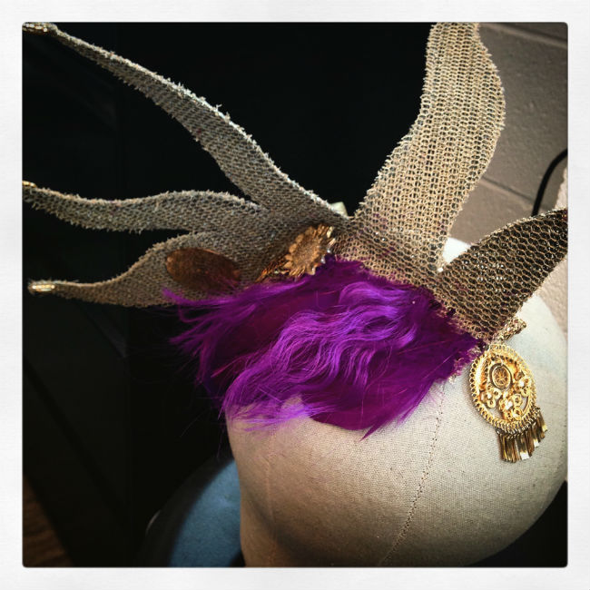 A burlap crown with purple hair glued to it like bangs