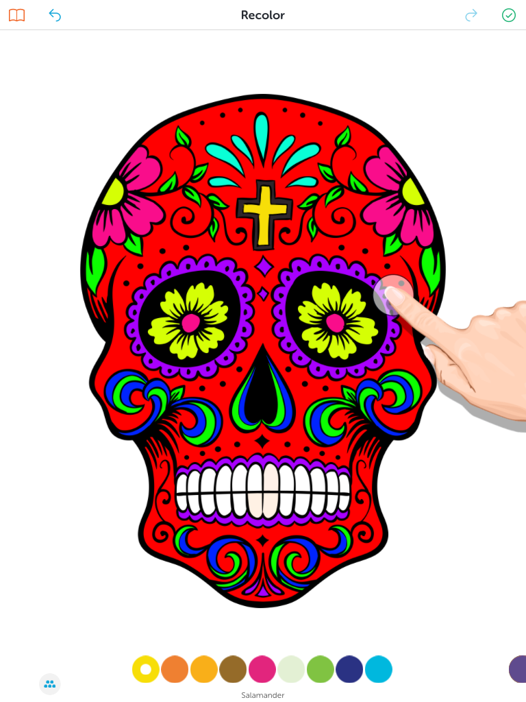 A sample coloring page from the app which is a skull.