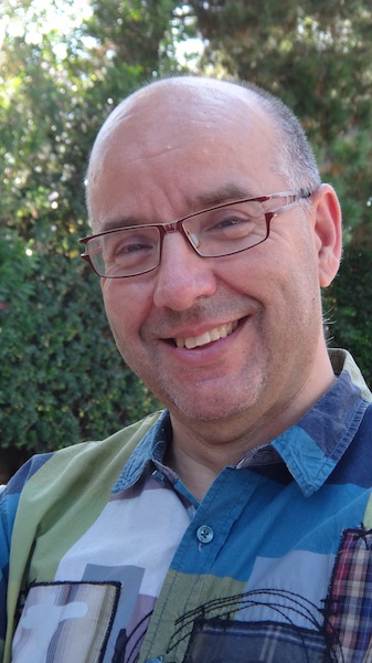 an older balding man with glasses