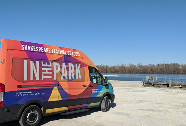 A colorful van that says Shakespeare Festival St. Louis is parked at a dock