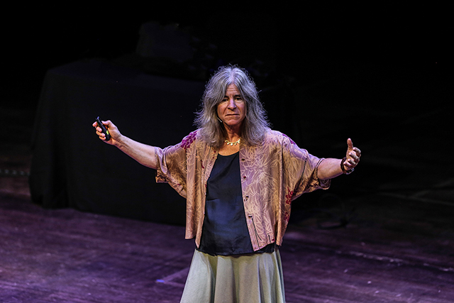 Woman giving a talk onstage