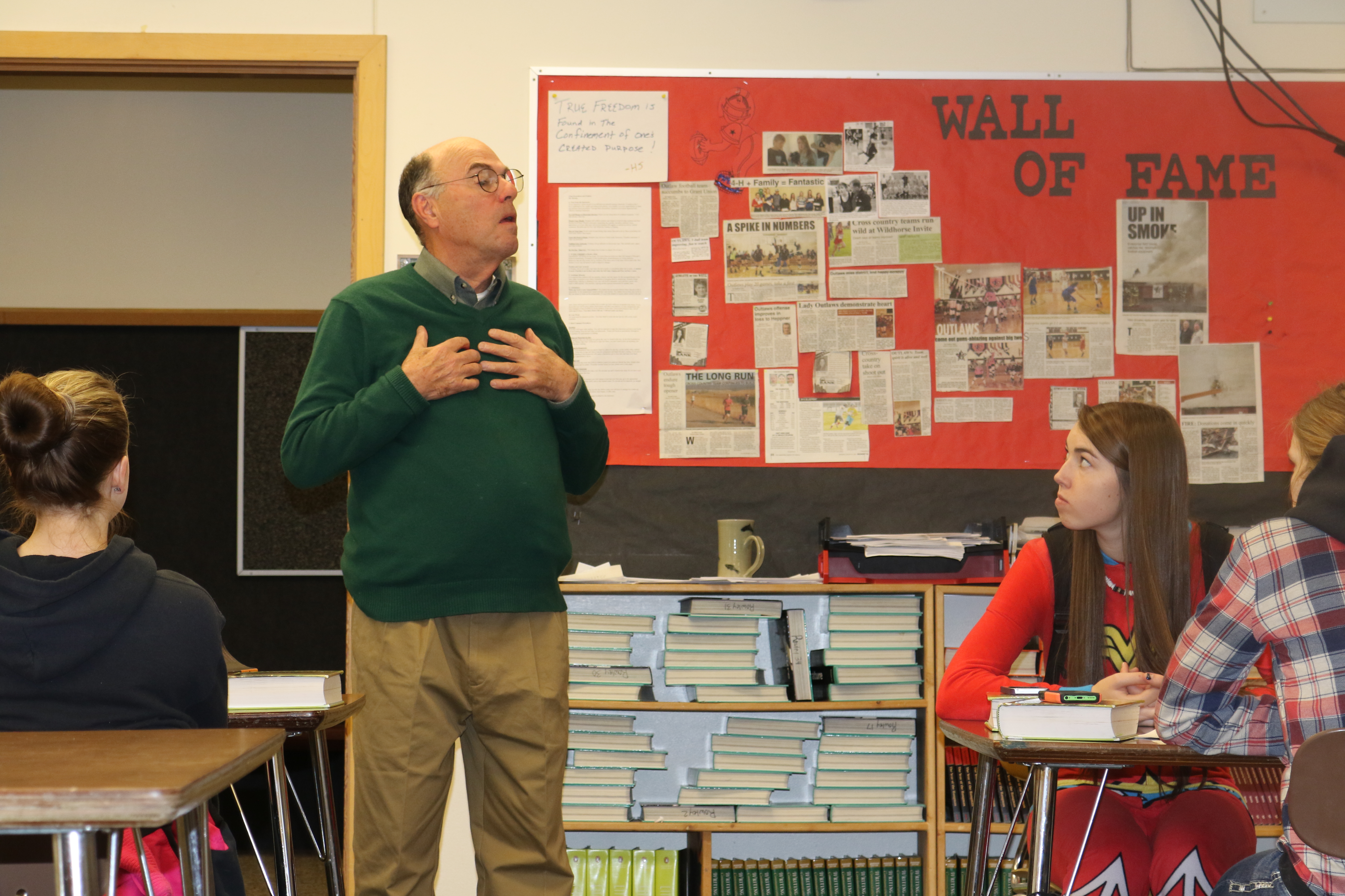 Mr. Wilder standing in front of a class speaking to students.