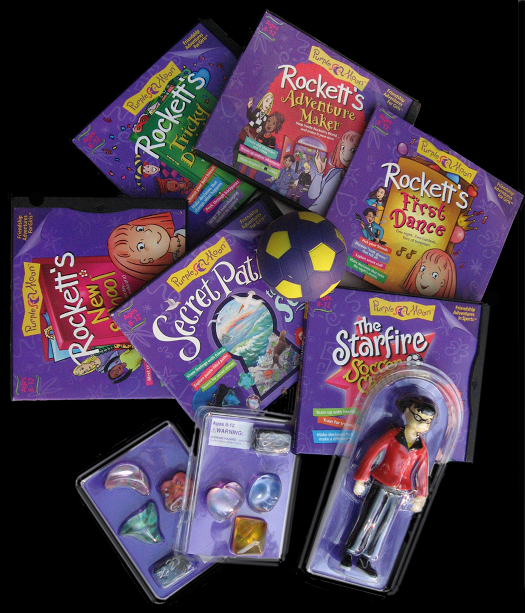 An array of video games and toy figures from Purple Moon. 
