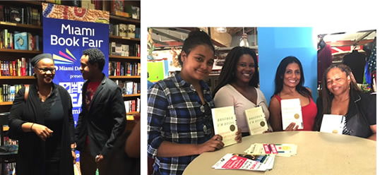 Left: Edwidge Danticat with a man stading in froint of a large Miami Book Fair poster