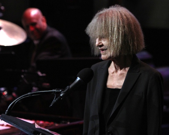 Tight shot of NEA Jazz Master Carla Bley speaking into a microphone