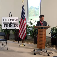 A woman at a podium.