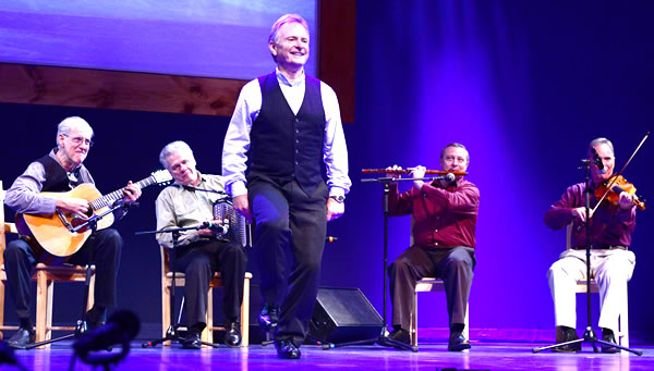 Kevin Doyle step-dancing onstage with band behind