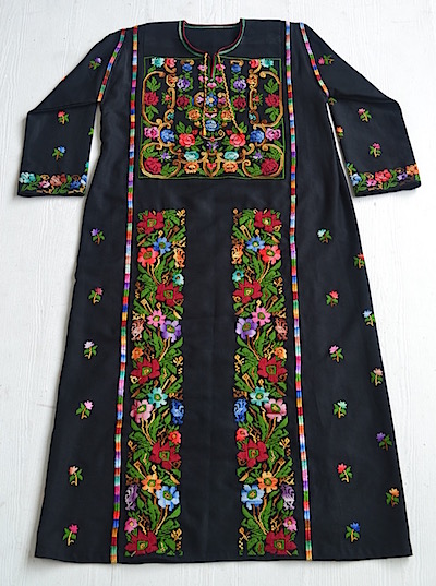 Photo of a dress with elaborate embroidery.