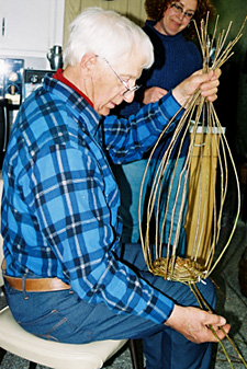 LeRoy Graber at work on a basket