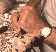 Close up of Mr. Pilarinos's hands carving