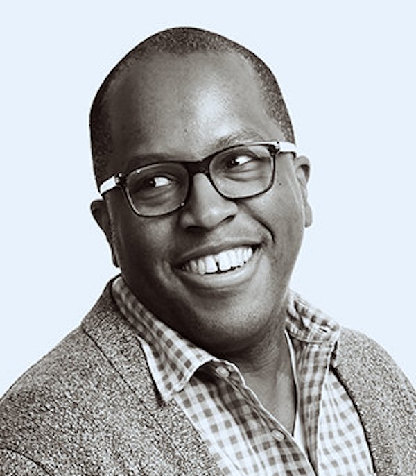 Headshot of a man smiling.