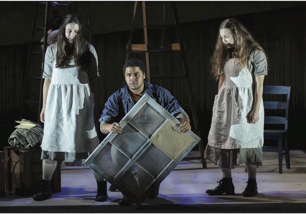 Three characters from Missy Mazzoli's Proving up, including one man who is kneeling flanked by two young women.